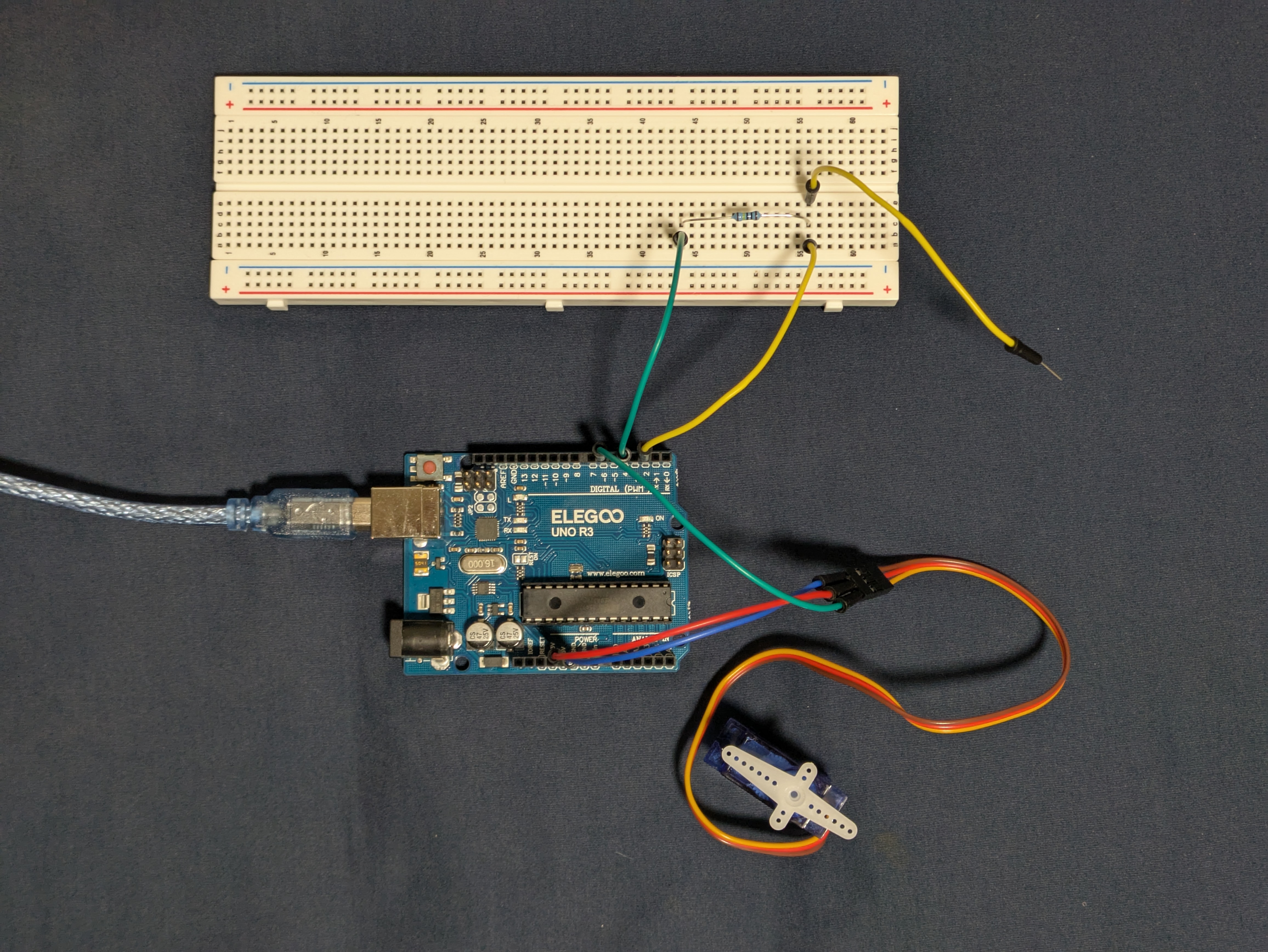circuit with servo motor and capacitive sensor